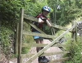 Lee manages the gate at the end of the track in Selworthy, 20.3 miles into the ride